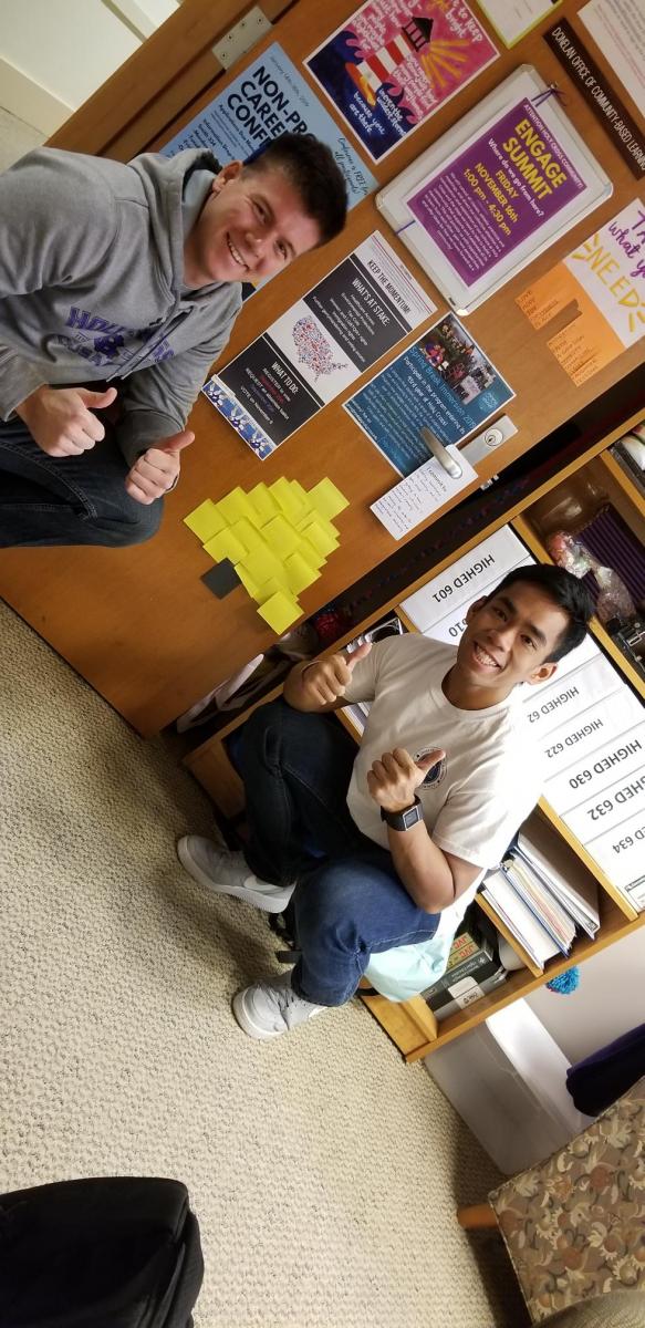 CBL Interns pose with their post-it note holiday tree.