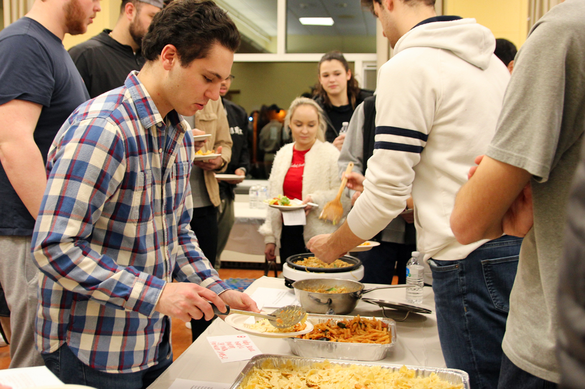 studnets serving pasta