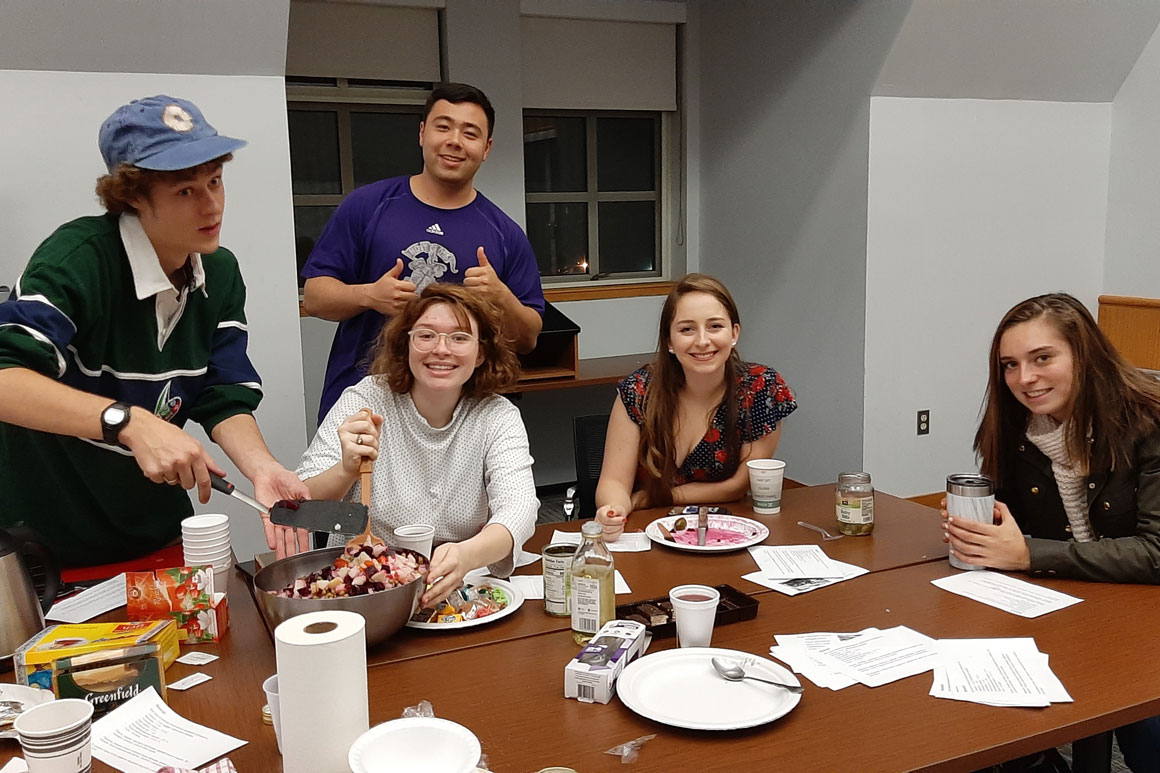 studnets sitting at a table with food