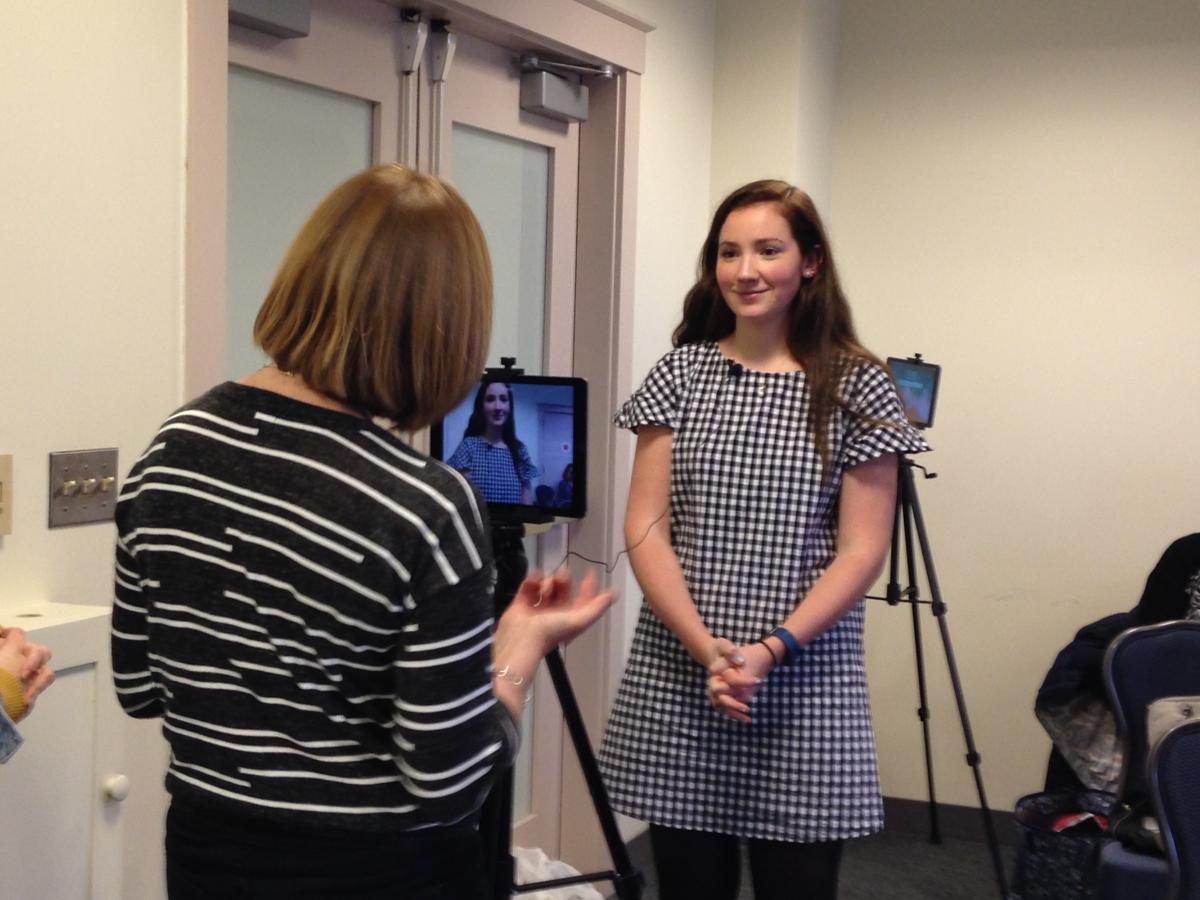 Prof. Franco and one student demonstrate filmmaking to conference attendees.