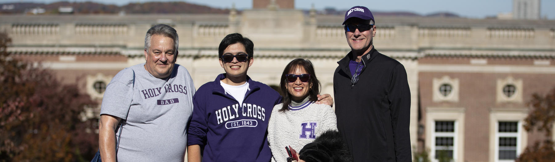 Family standing in front of Dinand library