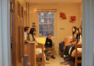 Six students sitting and chatting in Wheeler Hall