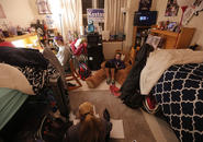 Three students sitting in Wheeler Hall doing homework
