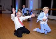 Kids sliding on dance floor