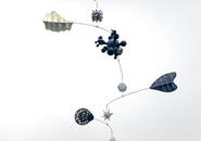 Hanging mobile with a variety of shapes and sizes