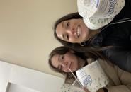 two young people holding toilet paper