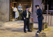 Shui Ta talks with policeman.