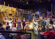 Shen Te invites audience to dance at her wedding.