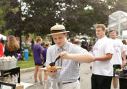 A student decorates a donut on the Kimball quad. Photo by Tom Rettig
