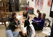 Students in Intermediate Drawing assemble their paper puppets