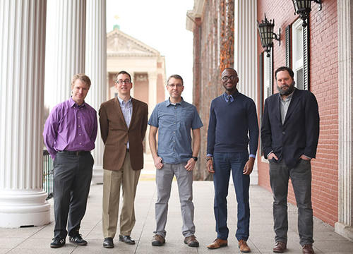 From left, Kevin Walsh, Aaron Seider, Justin McAlister, Andre Isaacs '05, Daina Harvey stand on Fenwick porch. Not pictured: K.J. Rawson.