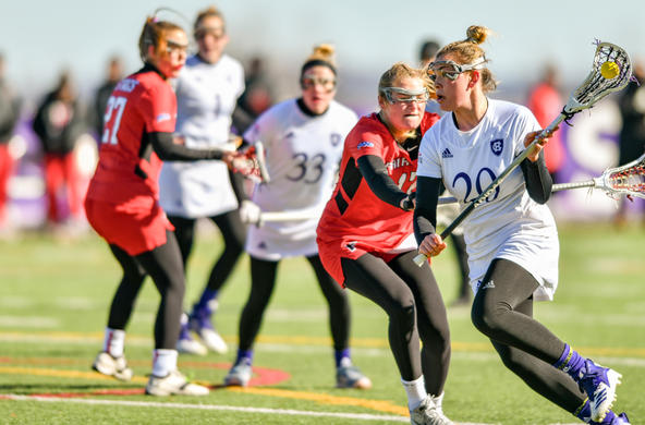 field hockey team competing on the field