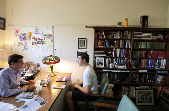 professor meeting with a student in professor's office
