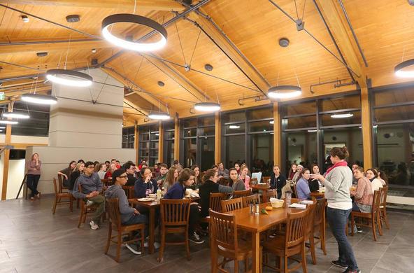 students sitting at tables at the Joyce Contemplative Center