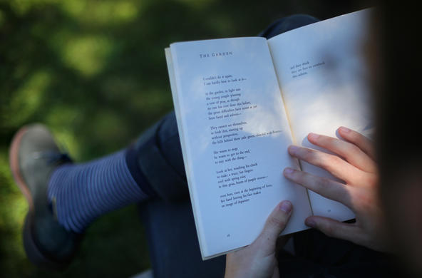 Student holding a book.