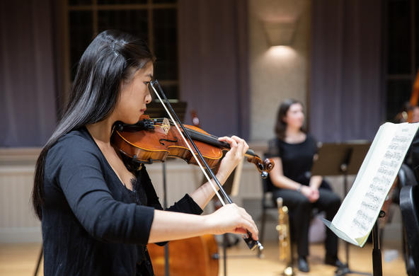 student playing the violin