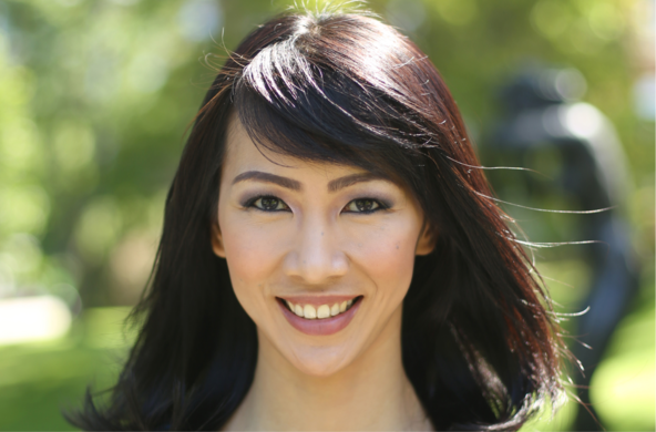 Professor Florencia Anggoro. She has straight brown hair and bangs swept to the side. She is smiling on what looks like a warm day in the summer.