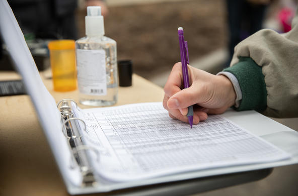 Student inputting data into a table
