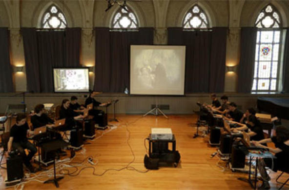 brooks concert hall with a projector and screen in the middle