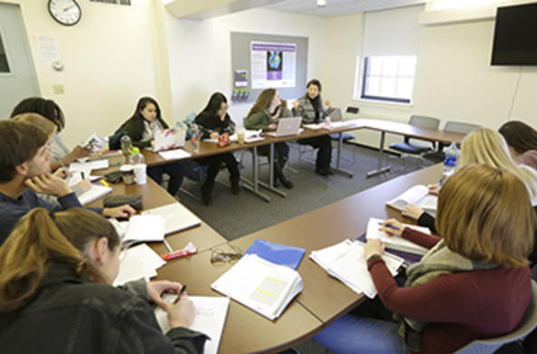 students and a professor in a classroom