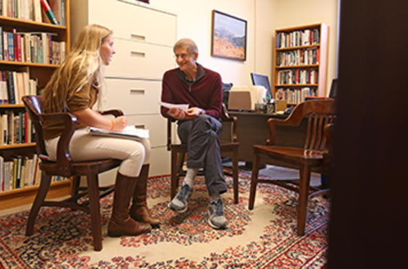 Student sitting in a professor's office