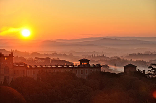 Sun rising over a city