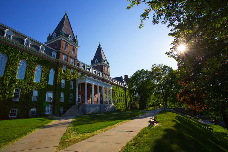 ivy-covered Fenwick Hall while sun is beginning to set