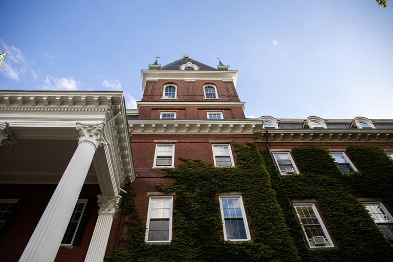 steep view of ivy-covered Fenwick Hall and Fenwick spire
