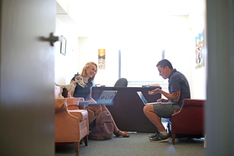 student meeting with a professor in his office