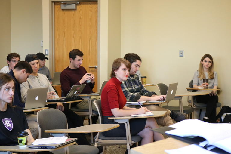 Clara Gibson sitting at a desk during class