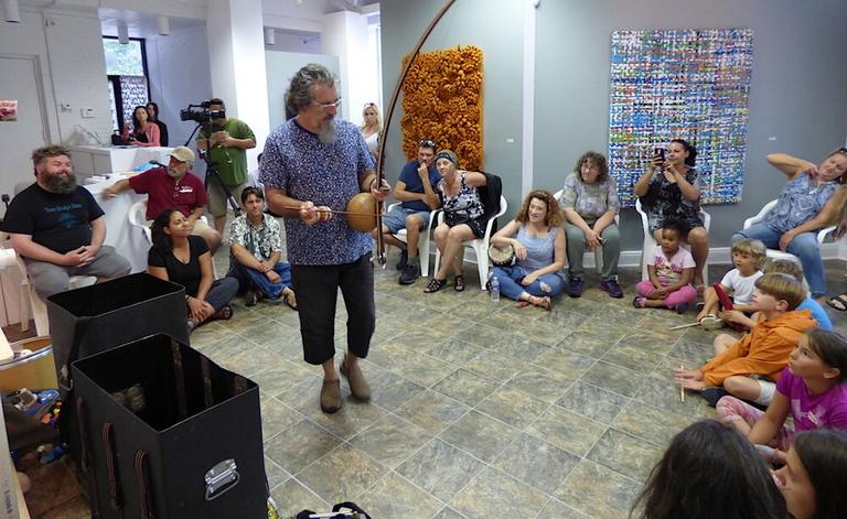 Brazialin percussionist Cyro Baptista playing the berimbau 
