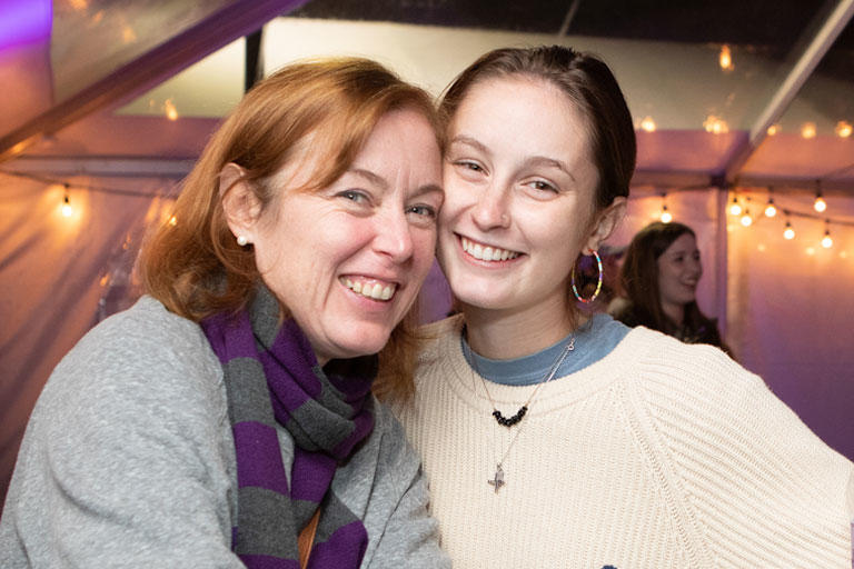 A student and parent smiling for the camera.
