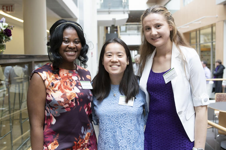 photo of three female students, smiling at the camera
