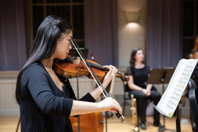 student playing the violin