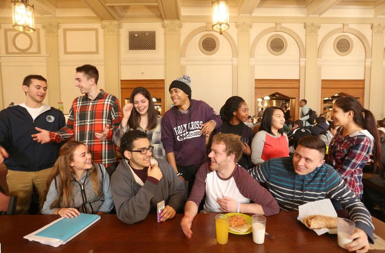 A group of students gather in the cafeteria.
