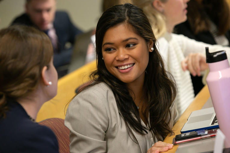Two students sitting and talking