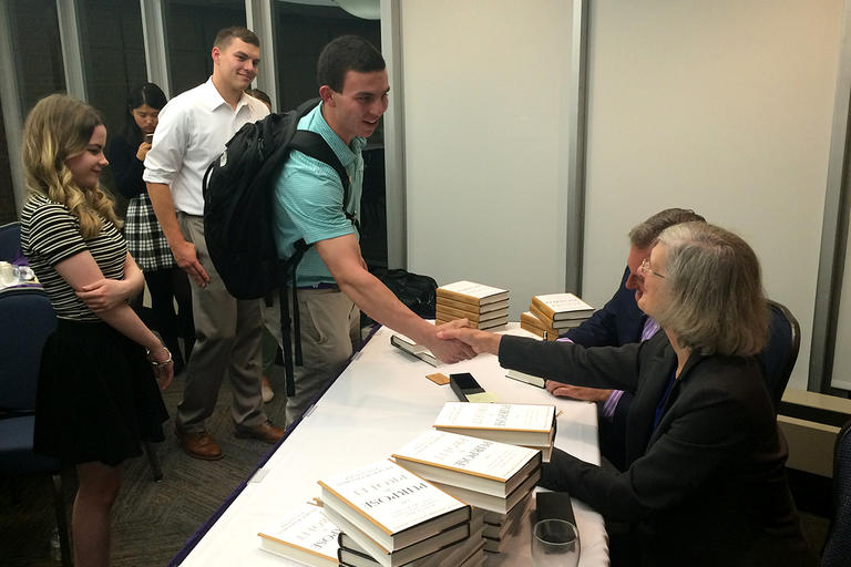 Students shaking hands