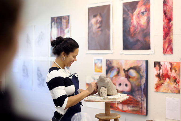 Student working on a sculpture