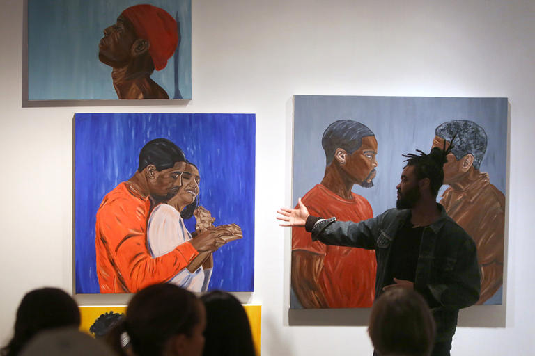 Student in front of artwork