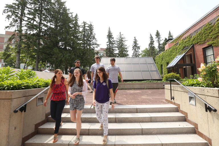group of students walking down library steps