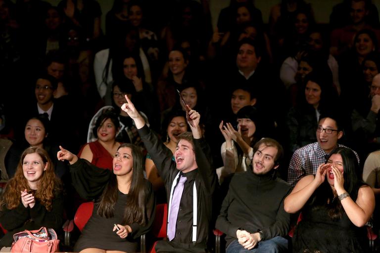 a large group of students cheering in seelos theater 