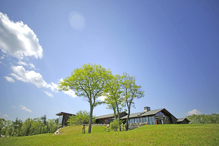 Joyce Contemplative Center with trees in the forefront