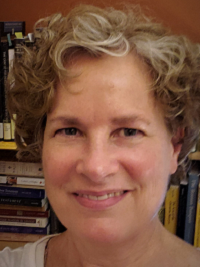 faculty headshot of woman with light colored short hair smiliing