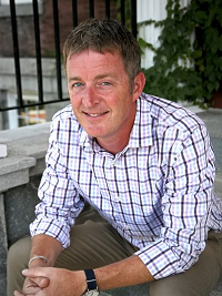headshot of professor josh farrell