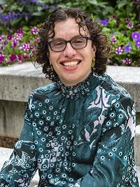 close up of a faculty member, they are smiling at the camera