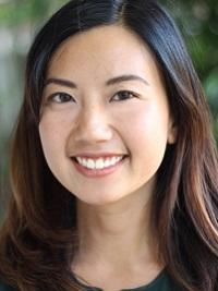 close up of a faculty member smiling at the camera