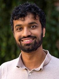 close up of a faculty member smiling at the camera