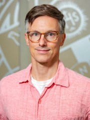 Francis Stevens man in a red button down shirt